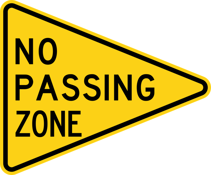 No Passing Zone sign: yellow pennant (a sideways triangle) reading NO PASSING ZONE.