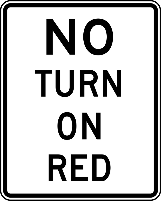 No Turn on Red sign: white rectangle with the words NO TURN ON RED.