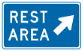 Rest Area sign: blue rectangle with the words REST AREA and a diagonal arrow.