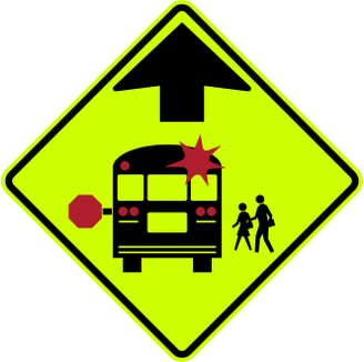 School Bus Stop Ahead sign: fluorescent yellow-green diamond with a school bus, children and an arrow.