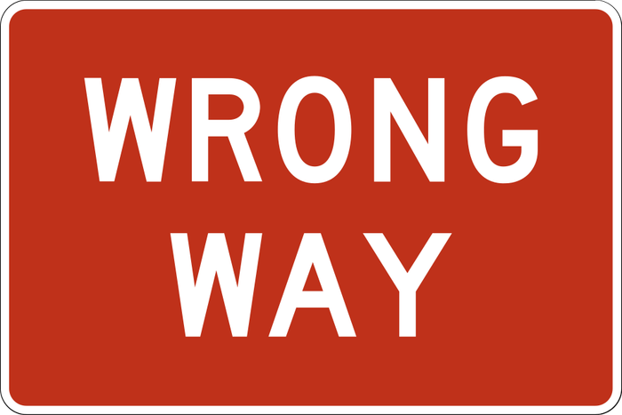Wrong Way sign: red rectangle with the white words WRONG WAY.